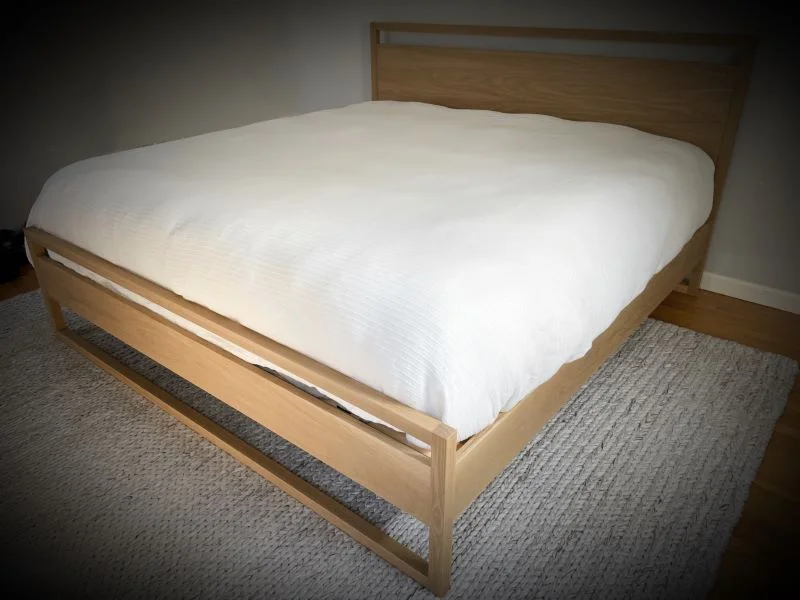 King size bed in solid white oak featuring mortise & tenon joinery and an ultra-flat finish for a natural look.